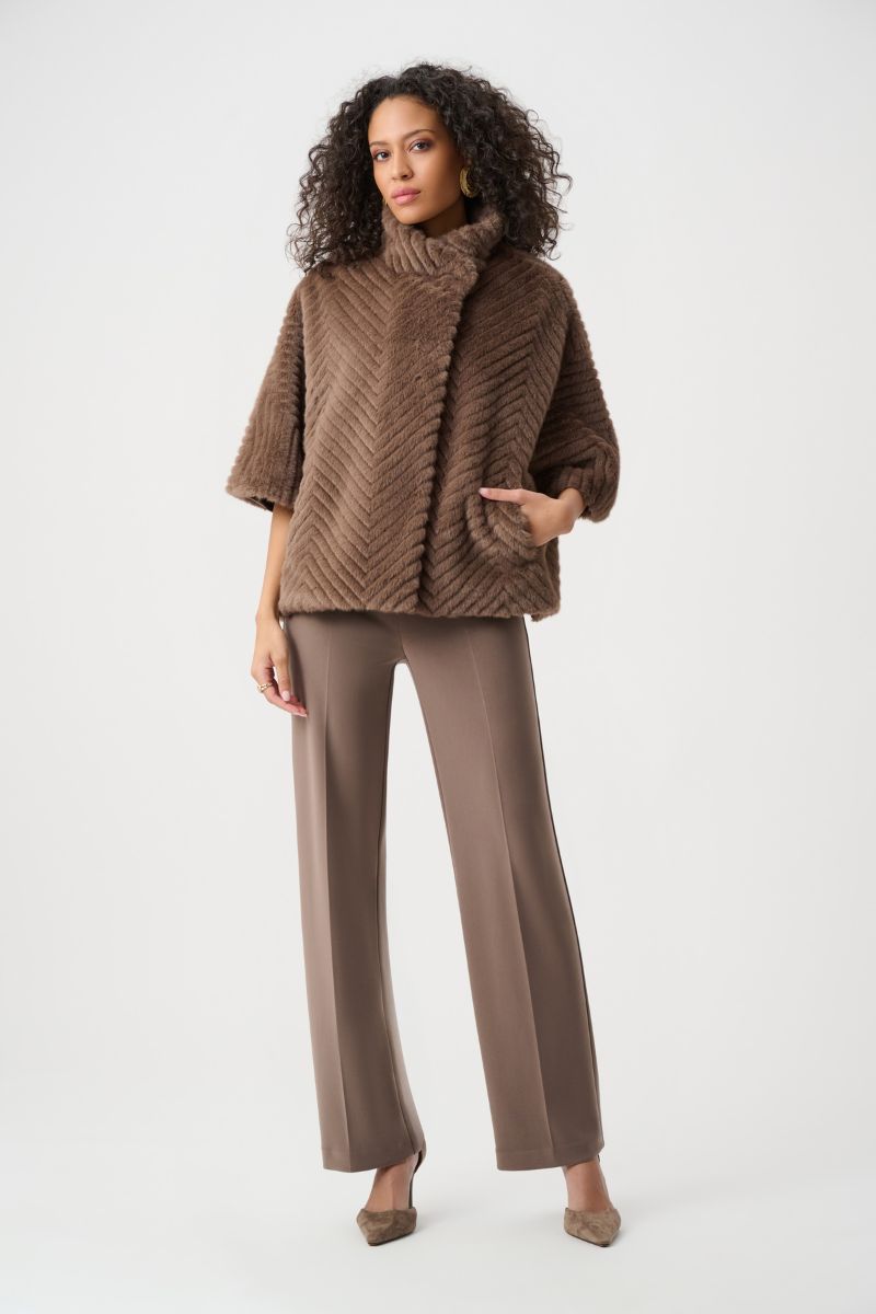 Woman wearing Joseph Ribkoff mink chevron faux fur cape jacket with tonal pants