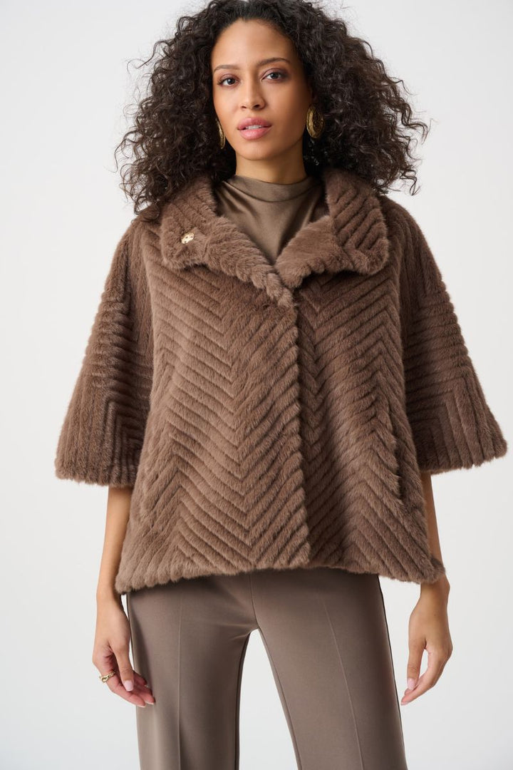 Woman wearing Joseph Ribkoff mink chevron faux fur cape jacket open collar detail