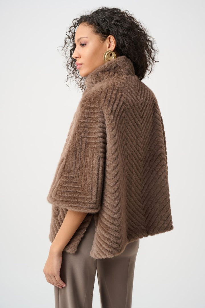 Woman wearing Joseph Ribkoff mink chevron faux fur cape jacket side view