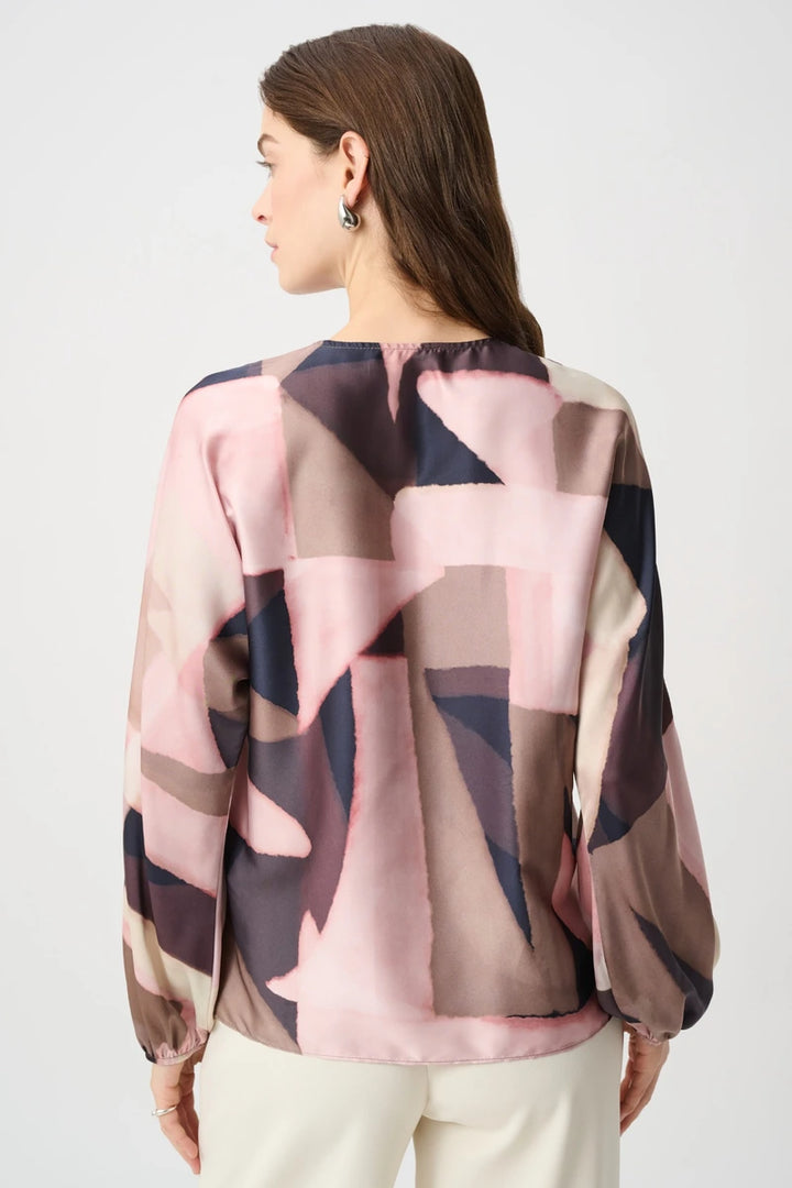 Joseph Ribkoff 264197 geometric print recycled satin top, back view showing boxy silhouette and long dolman sleeves.
