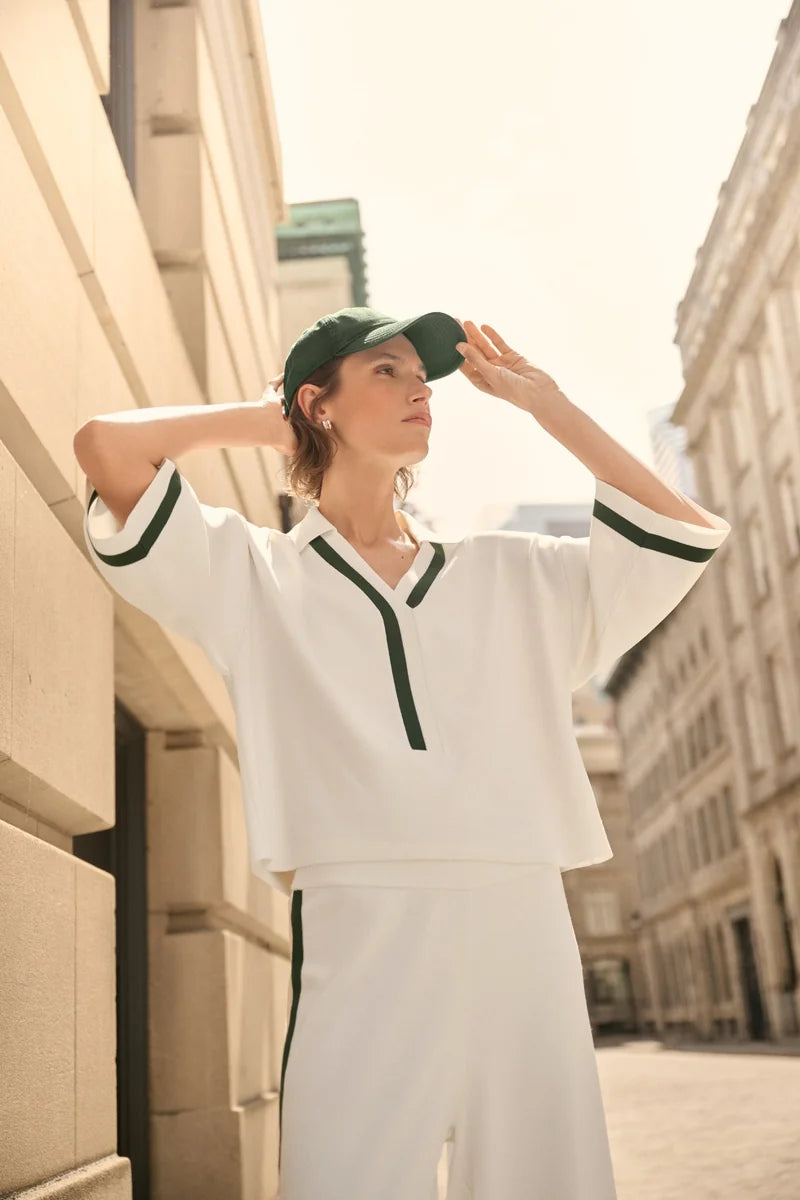 Joseph Ribkoff Stripe Trim Polo Top Vanilla/Vine Green 271630 outdoor styling view with contrasting green trim