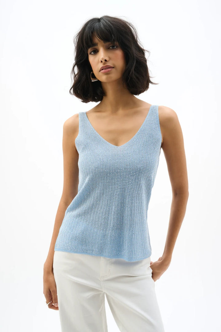 Woman wearing Joseph Ribkoff 252915s26 metallic knitted camisole sky blue front