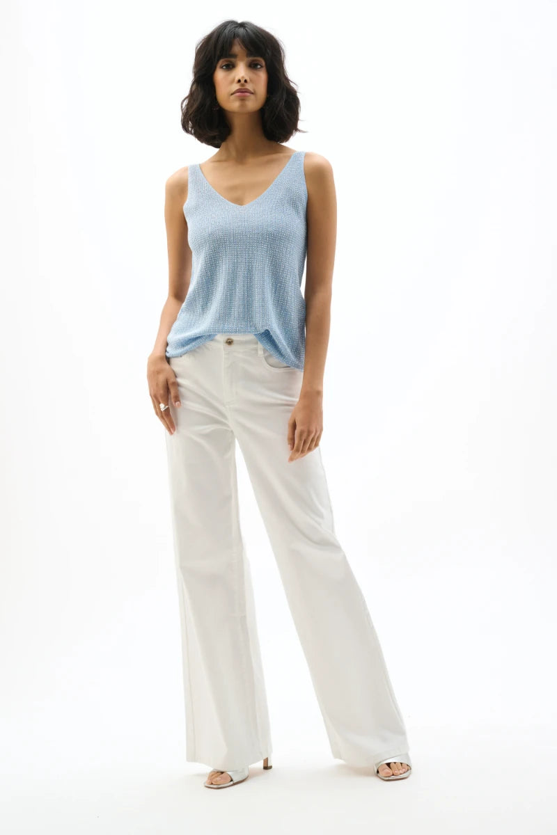 Woman wearing Joseph Ribkoff 252915s26 metallic knitted camisole sky blue outfit