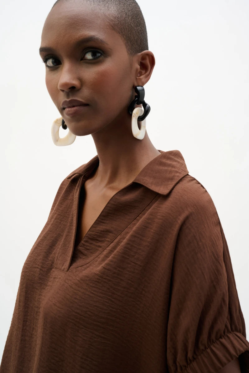 Woman wearing Woven Gauze Boxy Top With Shirred Sleeves in Mahogany by Joseph Ribkoff detail view