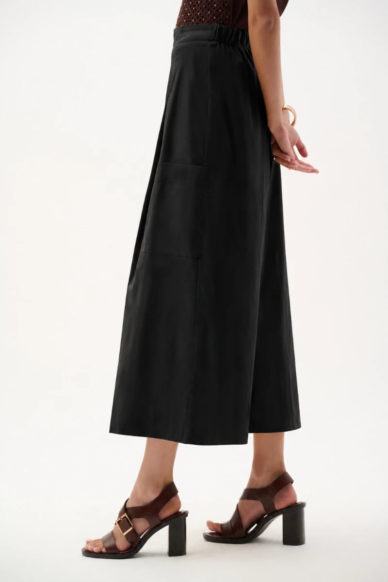 Woman wearing Stretch Poplin Pull-On Culotte Pants in Black by Joseph Ribkoff side view