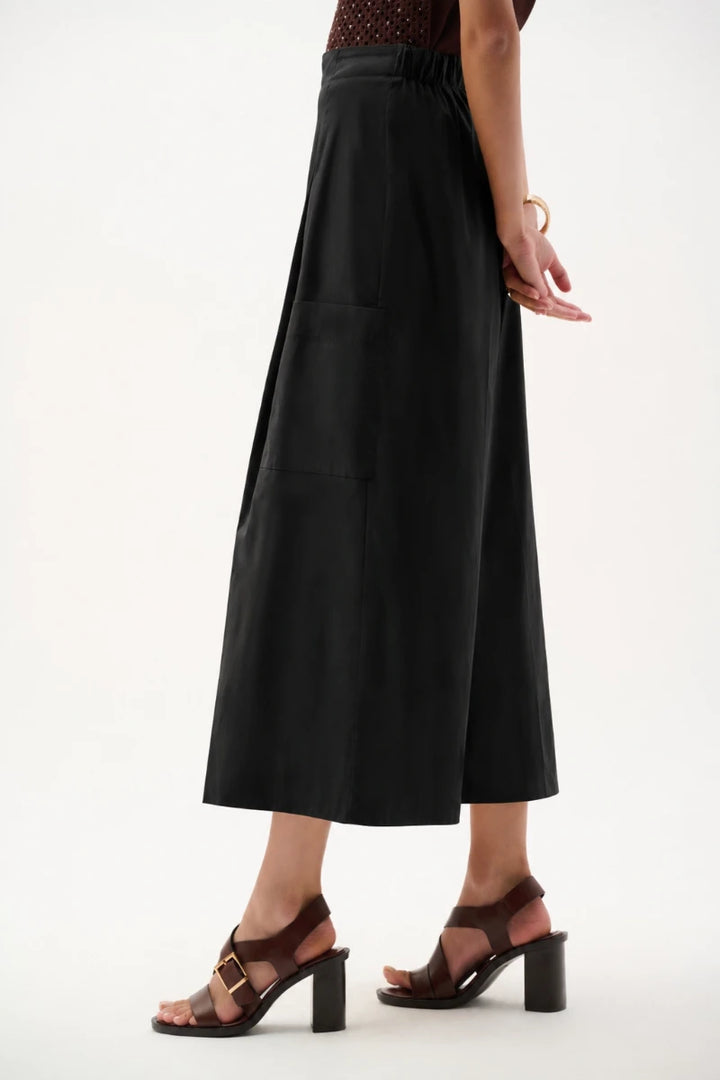 Woman wearing Stretch Poplin Pull-On Culotte Pants in Black by Joseph Ribkoff side view