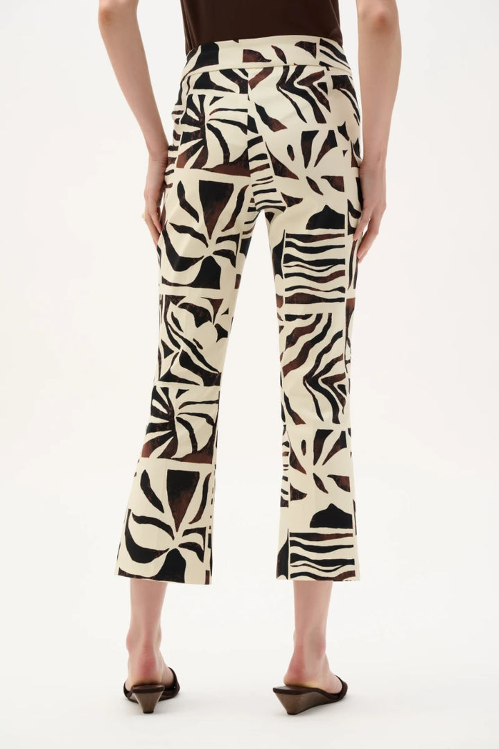 Woman wearing Millennium Tropical Print Flared Pull-On Pants in Beige/Multi by Joseph Ribkoff back view
