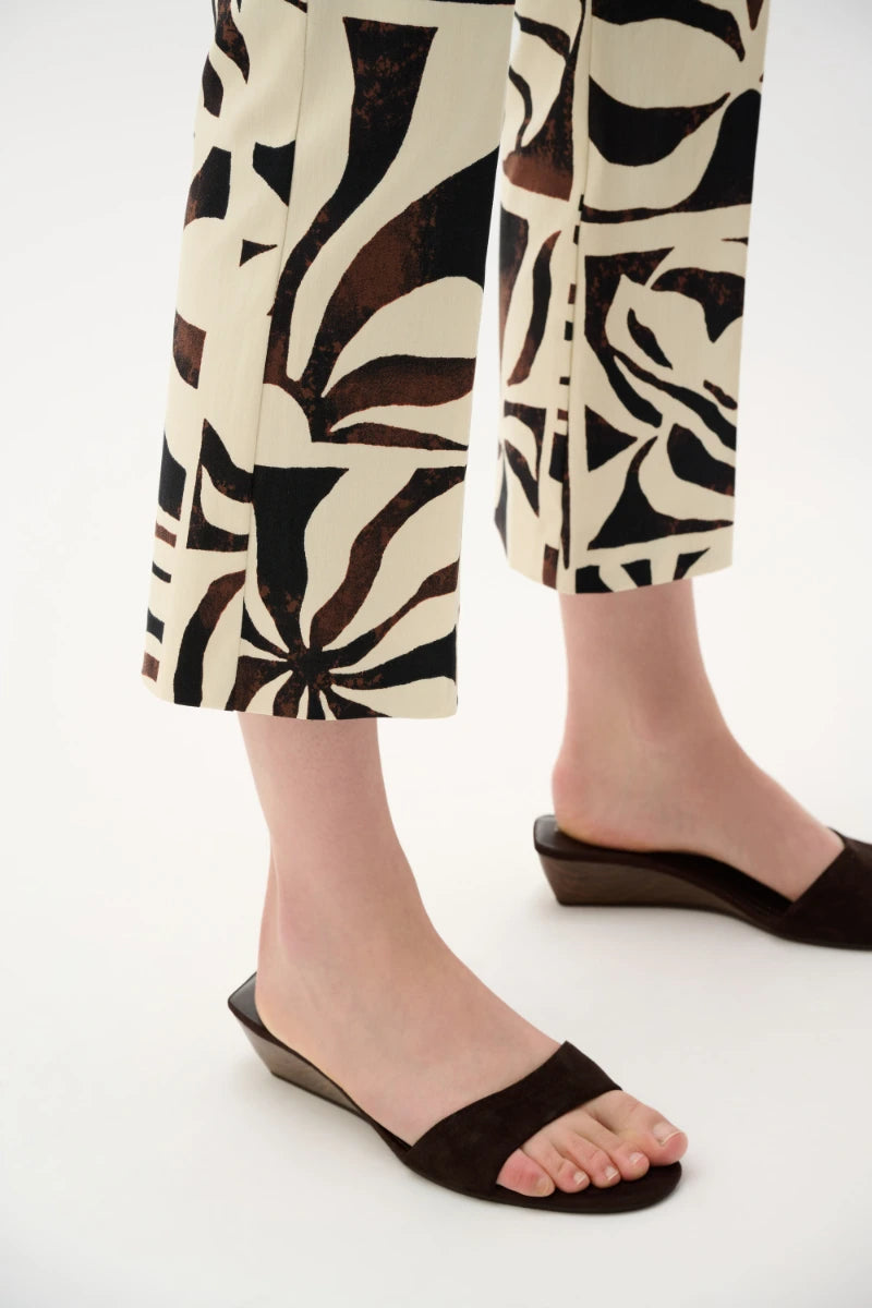 Woman wearing Millennium Tropical Print Flared Pull-On Pants in Beige/Multi by Joseph Ribkoff detail view