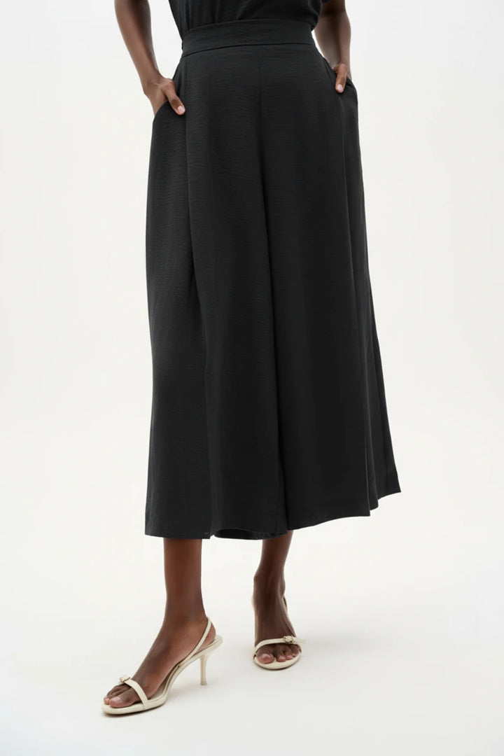 Woman wearing Gauze Pull-On Culotte Pants With Pleats in Black by Joseph Ribkoff front view