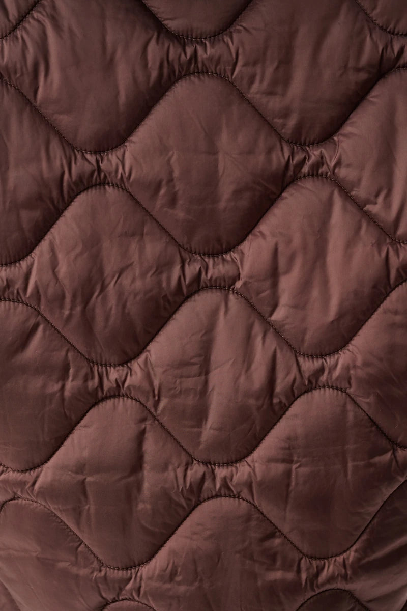 Woman wearing Hooded Quilted Cocoon Jacket in Mahogany by Joseph Ribkoff detail view