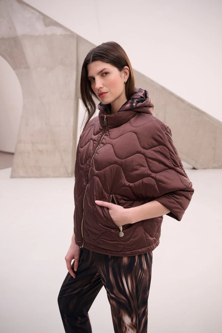 Woman wearing Hooded Quilted Cocoon Jacket in Mahogany by Joseph Ribkoff lifestyle view