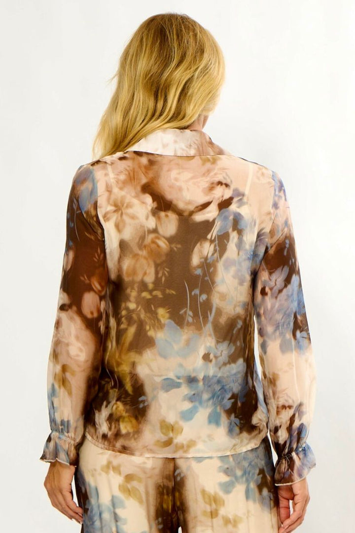 Woman wearing La Strada LSS26-86-400 Sheer Frill Front Shirt in Cream Chocolate Chambray Print back