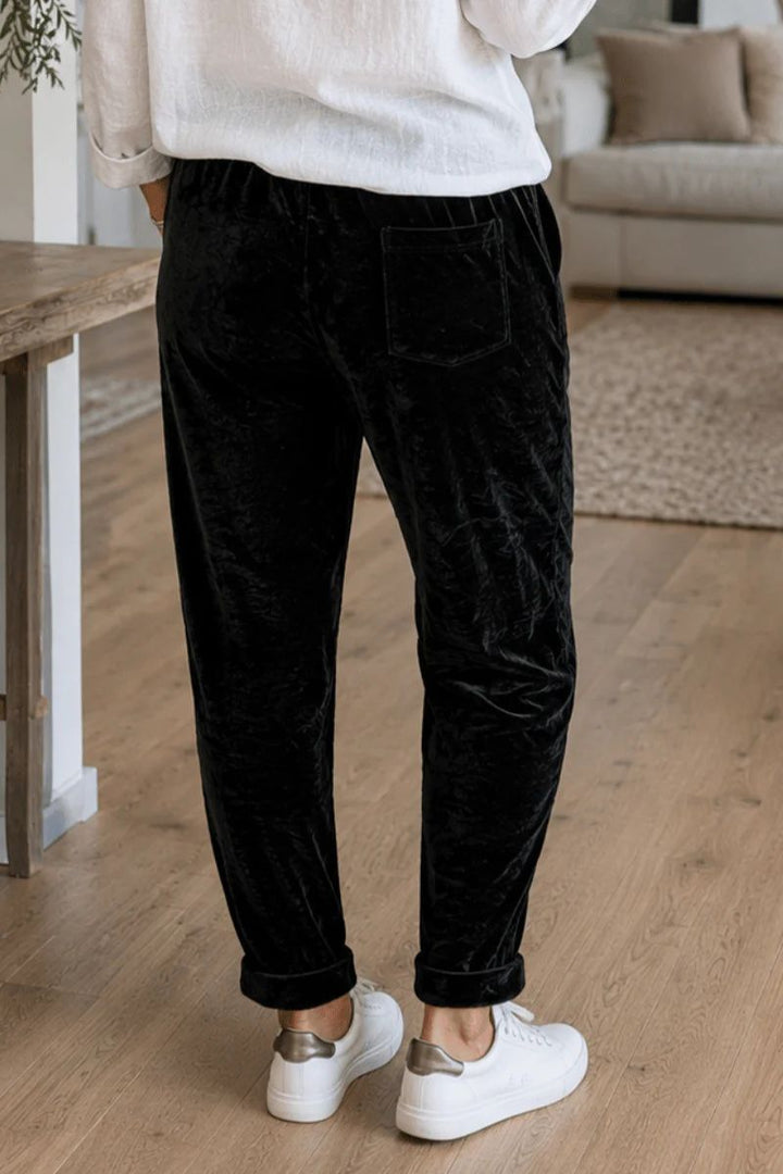 Woman wearing velvet jogger in Black by La Strada back