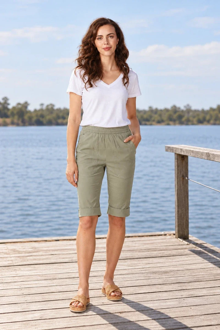 Lania Cuffed Short in sage with a plain white V-neck tee; summer outfit, lakeside jetty.