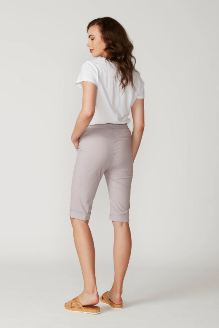 Lania the Label cuffed shorts in Stone, back three-quarter view.