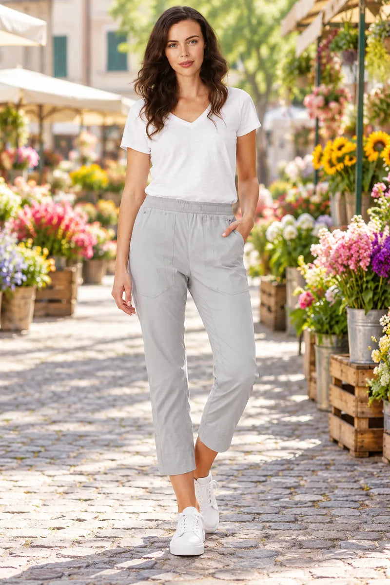 Lania Port 7/8 pants in nickel, styled with a plain white V-neck tee in a flower market.