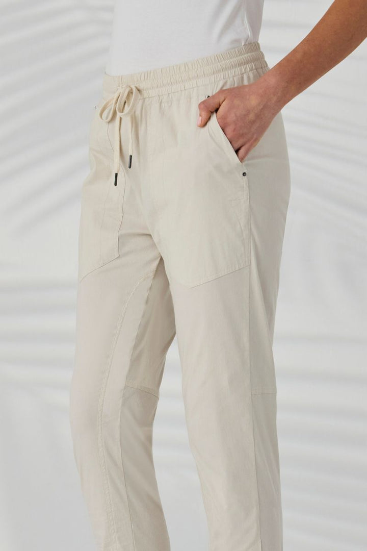 Lania Port Pant side view showing 7/8 length and cuff detail almond