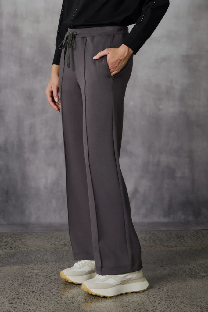 Woman wearing Bastian Pant in Carob by Lania The Label NLA3971 side view