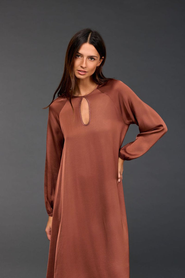 Woman wearing Conti Sienne Dress in Sienne by Lauren Vidal front