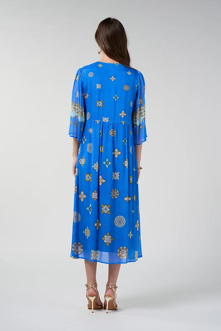 Alt text: Loobie's Story Dambulla Midi Dress LS3308 in Azure Multi back view showing gathered A-line skirt and placement print