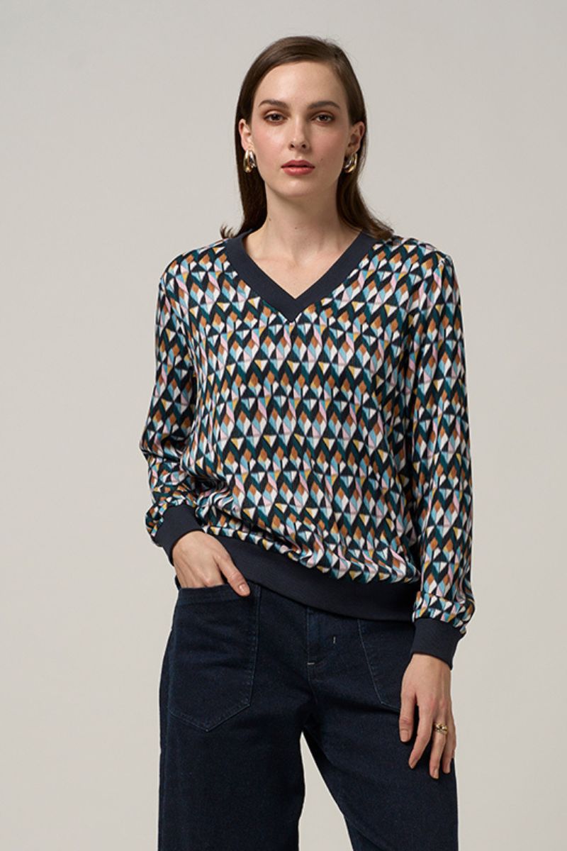 Woman wearing Madly Sweetly facet V neck top multi MS1505 front
