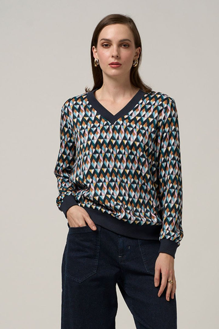 Woman wearing Madly Sweetly facet V neck top multi MS1505 front