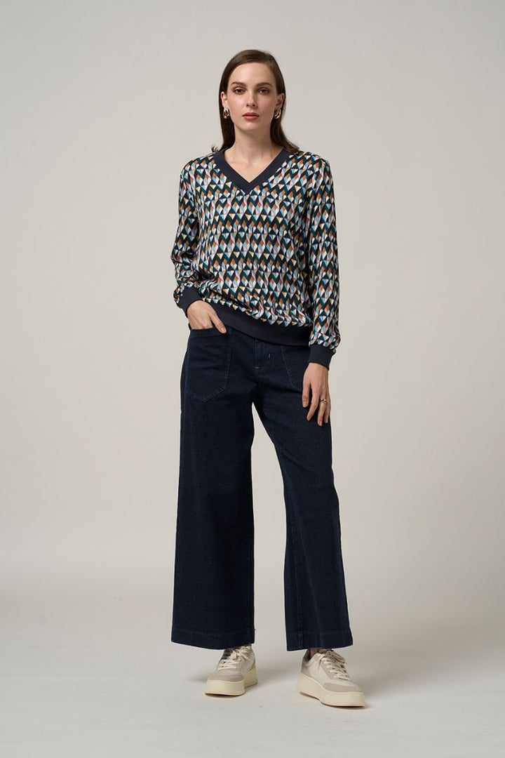 Woman wearing Madly Sweetly facet V neck top multi MS1505 styled