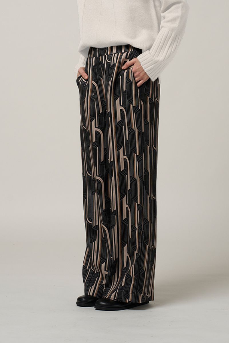Woman wearing Madly Sweetly Freefall pant black multi MS1565 closeup