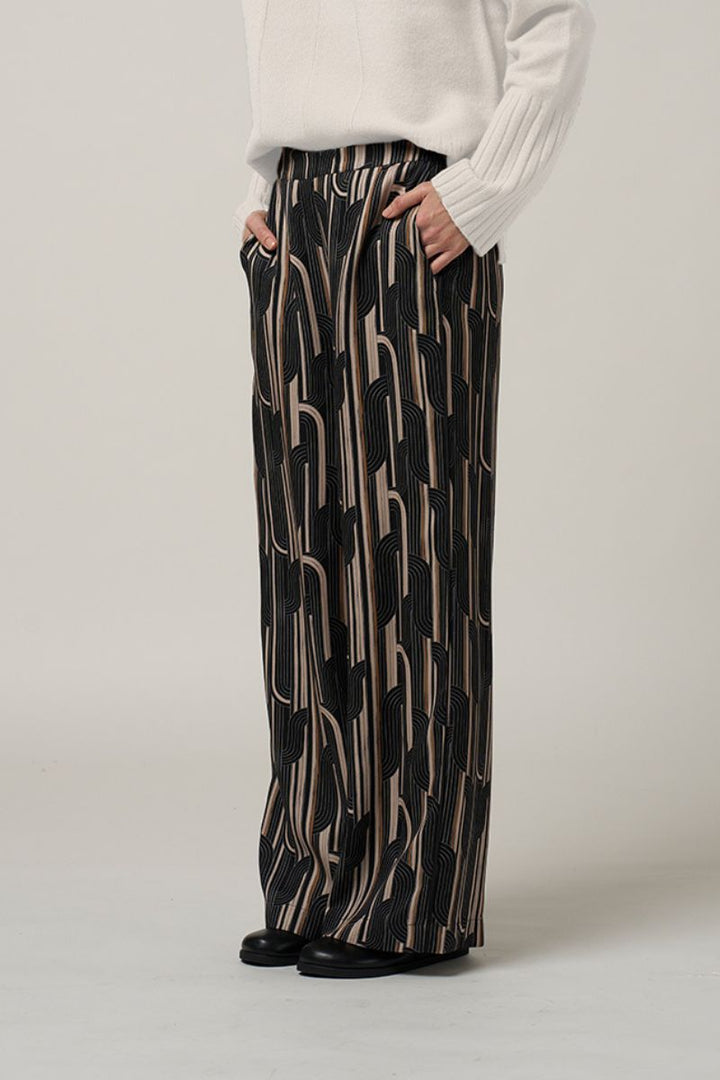 Woman wearing Madly Sweetly Freefall pant black multi MS1565 closeup