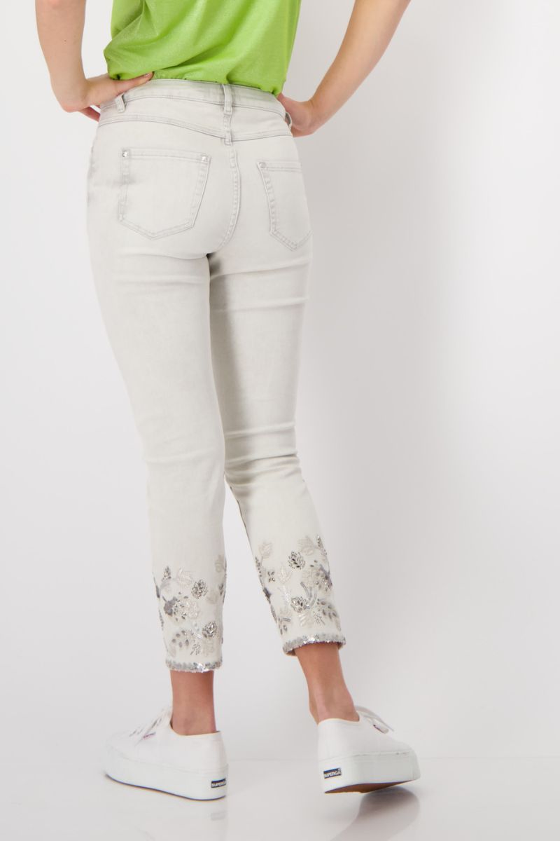 Woman wearing Monari 408957MNR embroidered denim jeans in marble back view