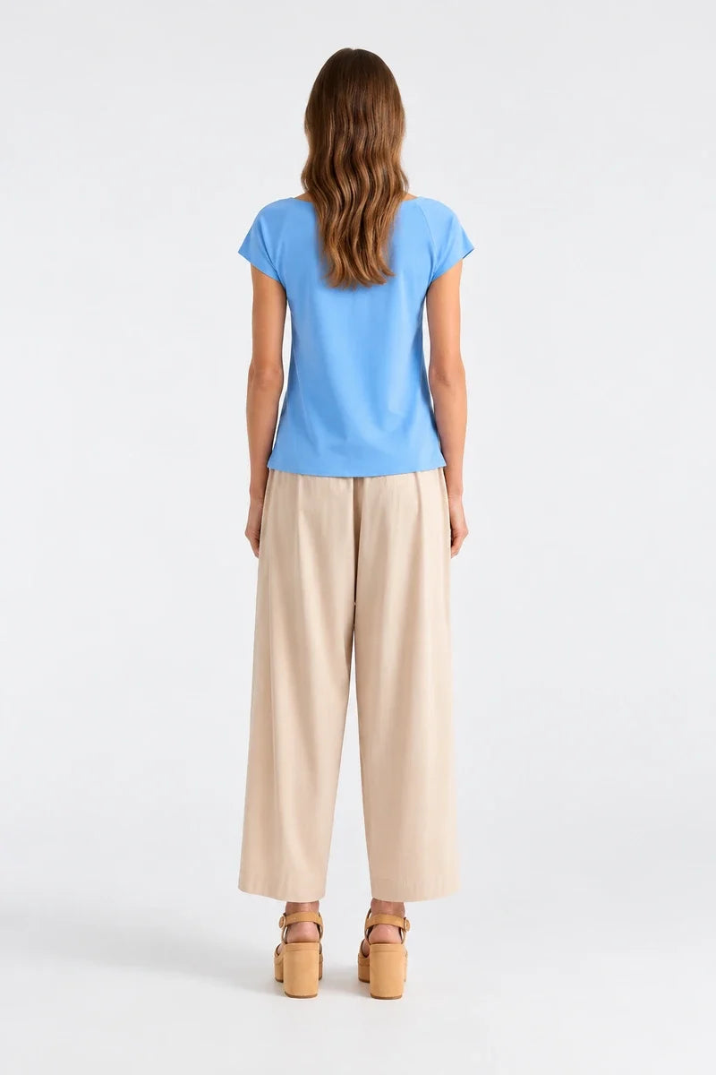 AI-generated model wearing Mela Purdie Raglan Shell F01 212 in Miami, back view