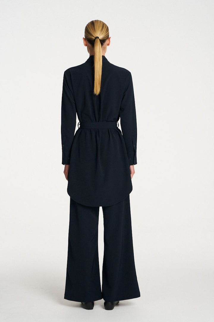 Woman wearing Cylinder Tunic in Black by Mela Purdie back