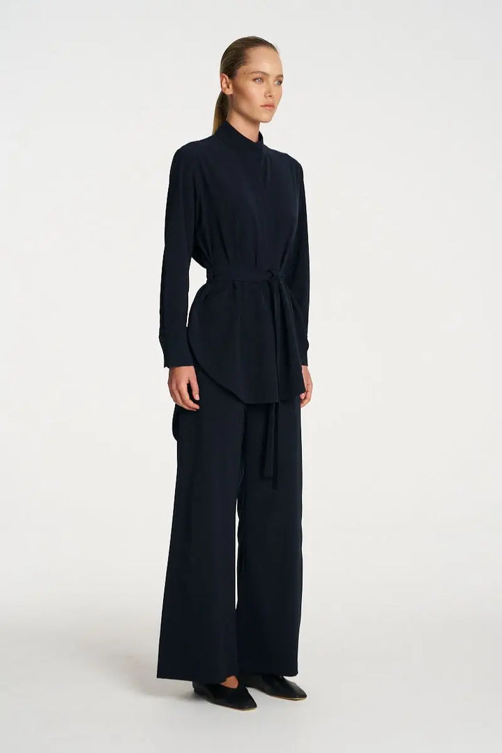 Woman wearing Cylinder Tunic in Black by Mela Purdie side
