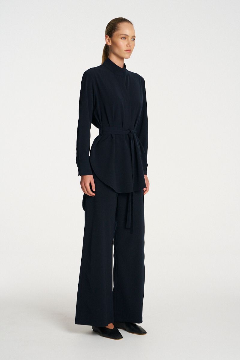 Woman wearing Cylinder Tunic in Black by Mela Purdie side