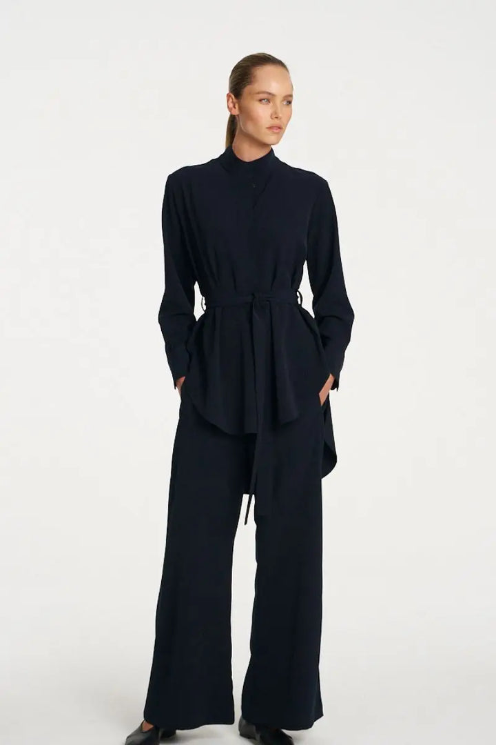 Woman wearing Cylinder Tunic in Black by Mela Purdie styled