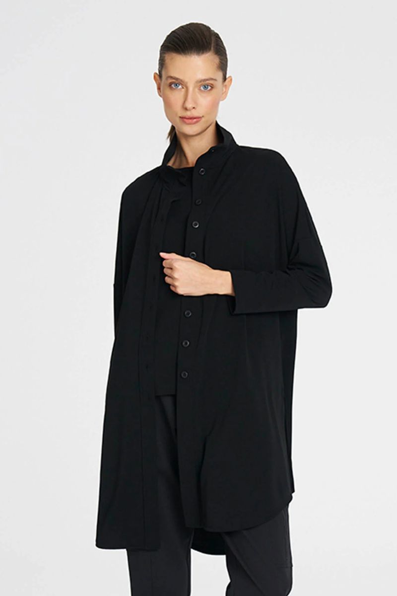 Woman wearing Tab Funnel Jacket in Black by Mela Purdie styled