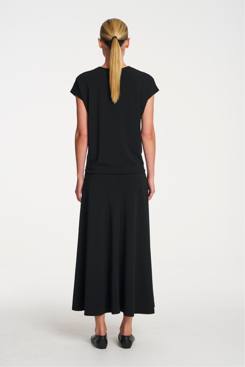 Woman wearing Mid Skirt in Black by Mela Purdie back