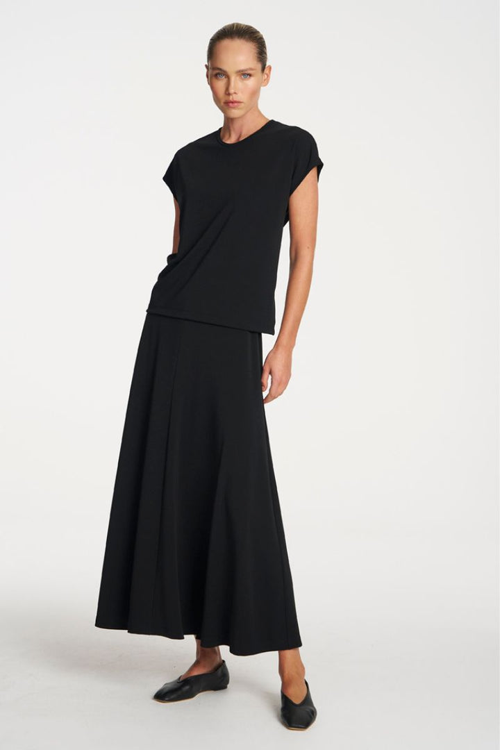 Woman wearing Mid Skirt in Black by Mela Purdie front