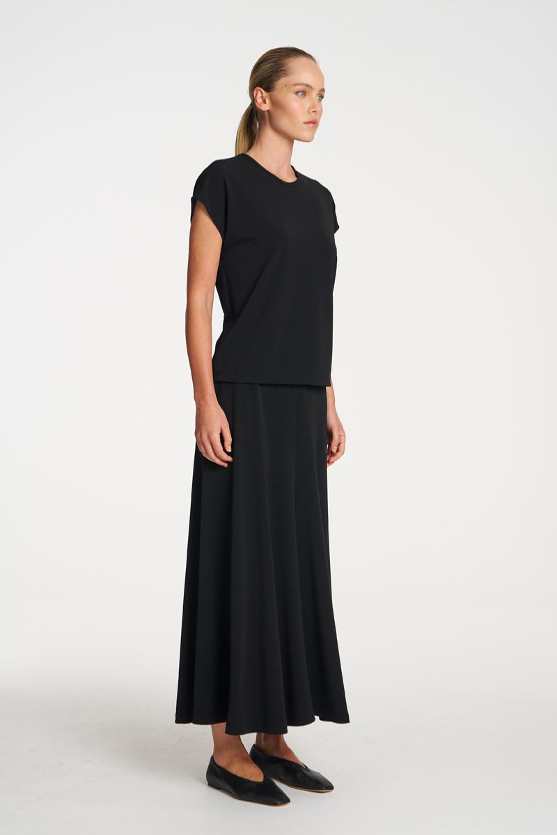 Woman wearing Mid Skirt in Black by Mela Purdie side