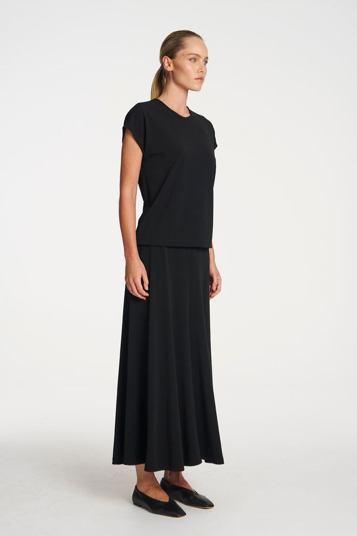 Woman wearing Mid Skirt in Black by Mela Purdie side