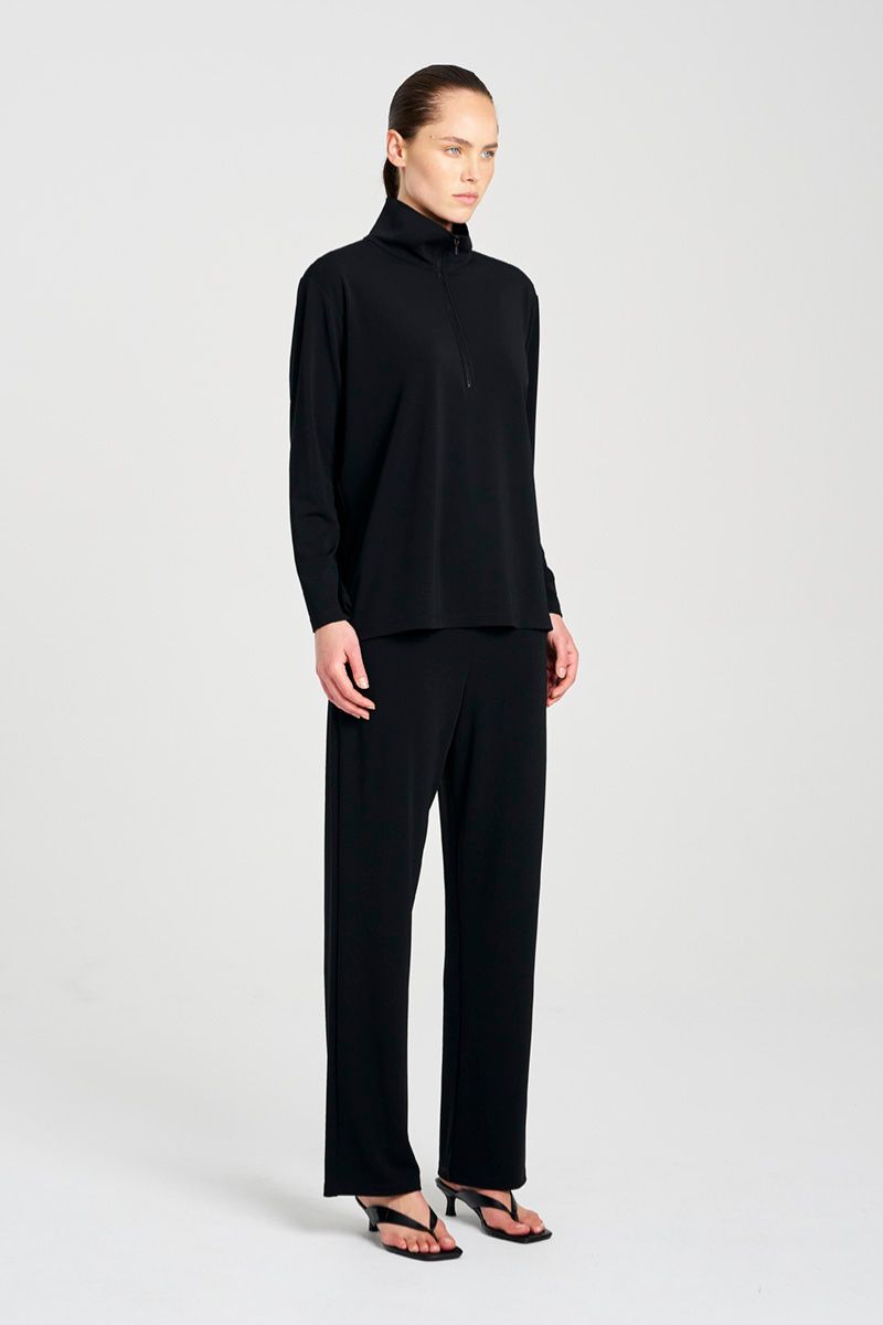 Woman wearing Zip Front Sweater in Black by Mela Purdie side