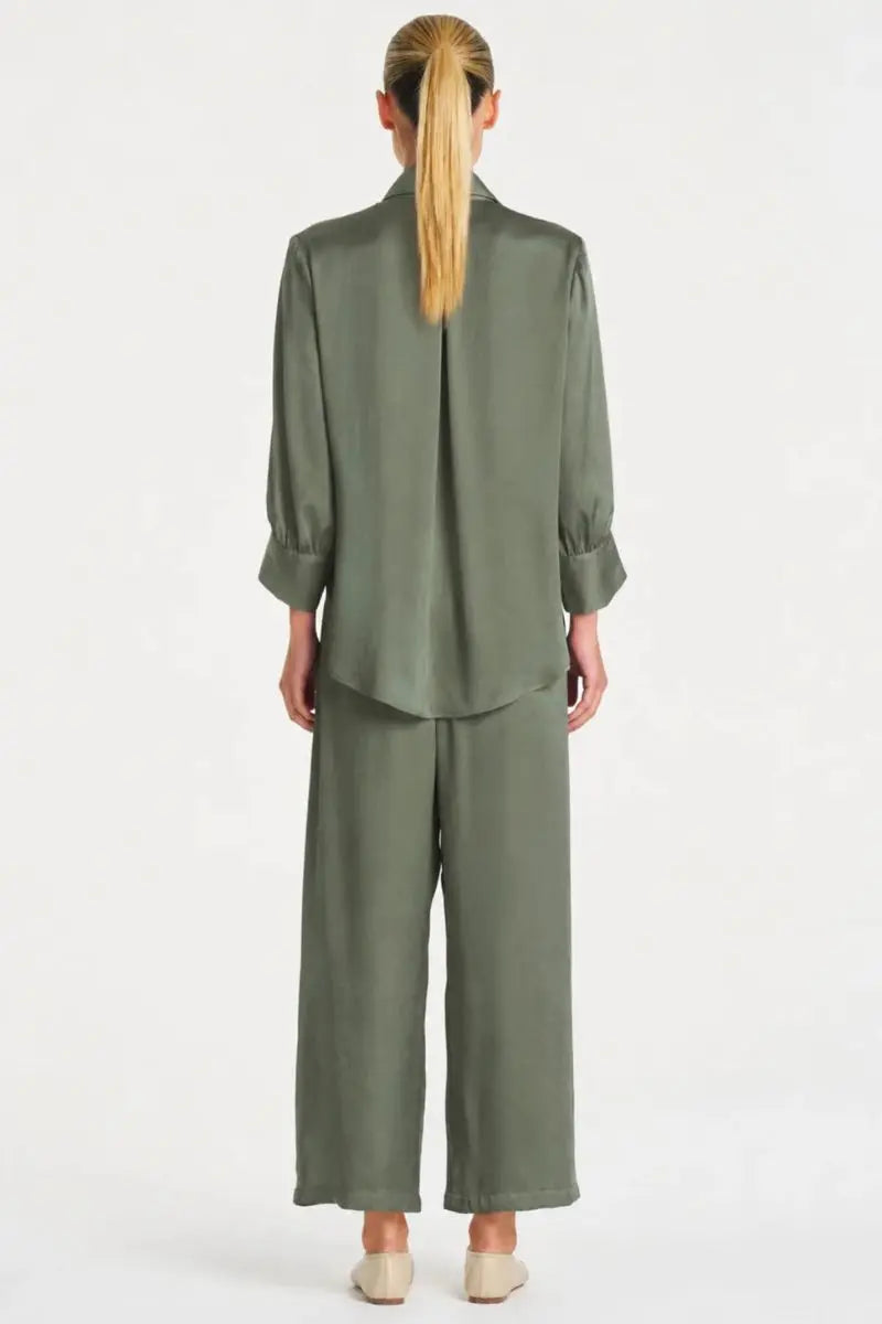 Woman wearing Pace Pant in Sage Mirror Satin by Mela Purdie back