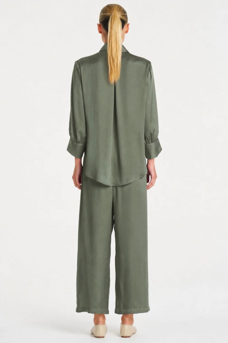 Woman wearing Pace Pant in Sage Mirror Satin by Mela Purdie back