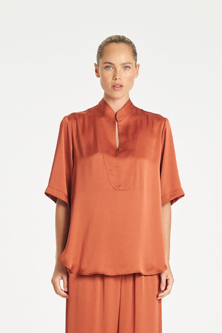 Woman wearing Swish Tux Plaza in Copper Mirror Satin by Mela Purdie front