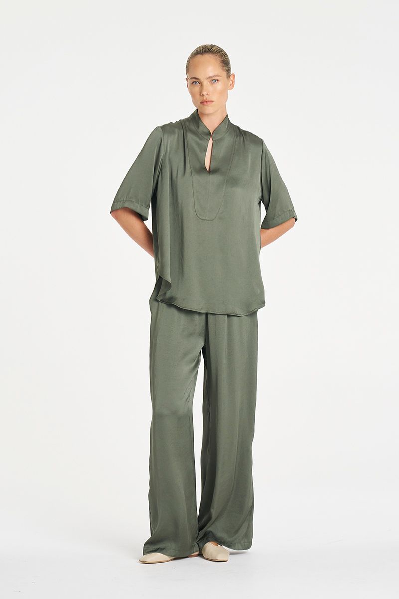 Woman wearing Swish Tux Plaza in Sage Mirror Satin by Mela Purdie styled