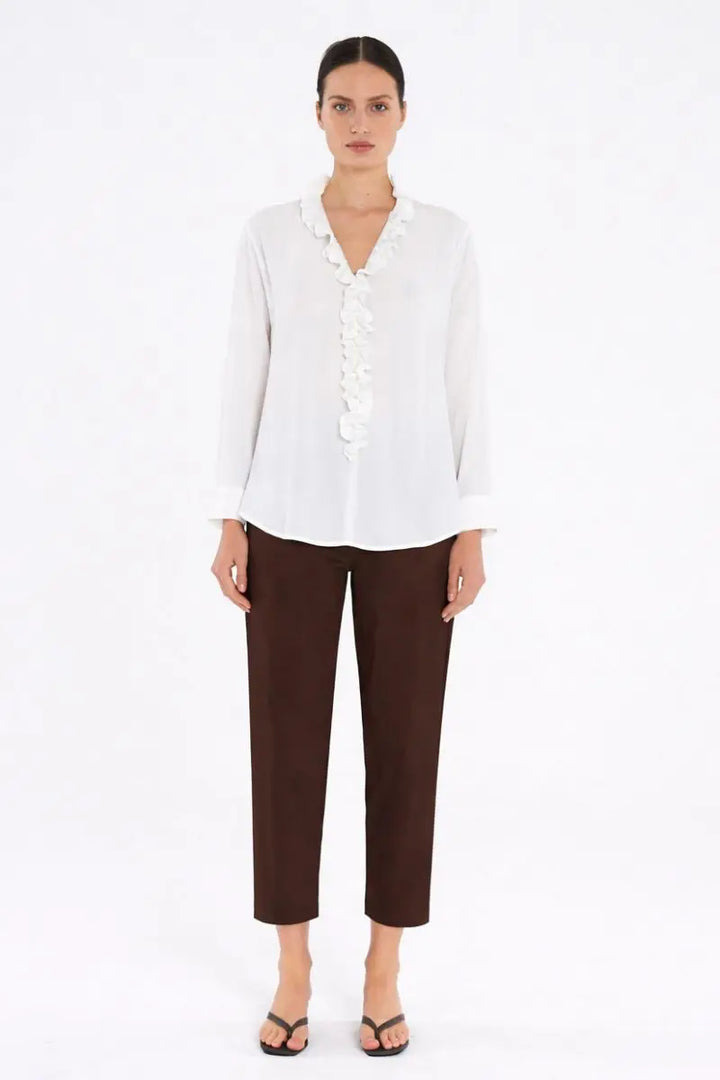 Woman wearing Nomad Pant in Fudge by Mela Purdie front