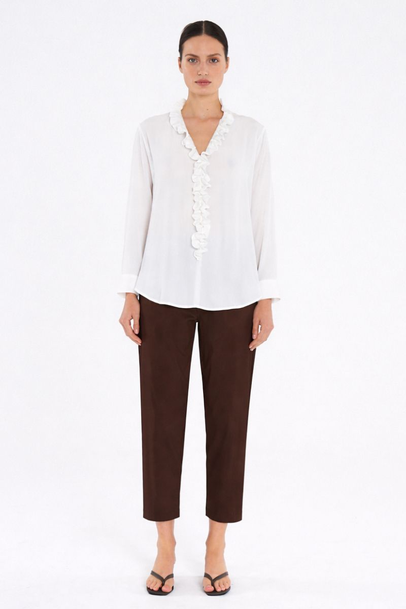 Woman wearing Nomad Pant in Fudge by Mela Purdie front