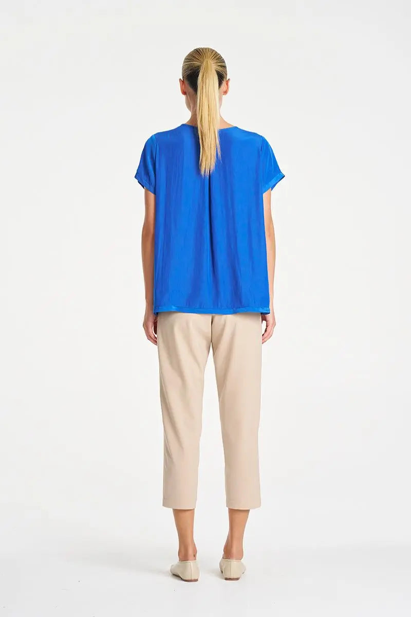 Woman wearing Travel T in Lagoon Mache by Mela Purdie back