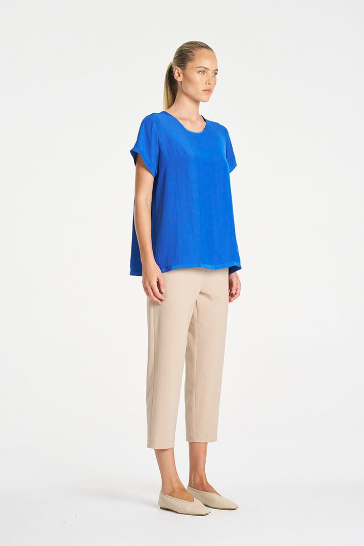 Woman wearing Travel T in Lagoon Mache by Mela Purdie side