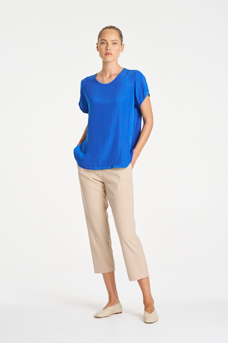 Woman wearing Travel T in Lagoon Mache by Mela Purdie styled